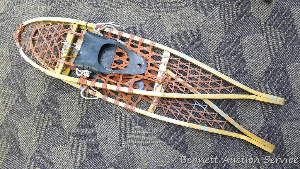 Pair of Iverson snowshoes 46-1/2" x 11" with rubber boot bindings. Shows a lot of use.