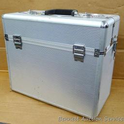 Aluminum storage case 18" x 15" x 9" with combination locks and fold down tops sections for access.