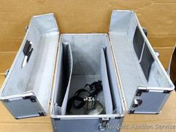 Aluminum storage case 18" x 15" x 9" with combination locks and fold down tops sections for access.