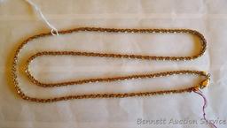 Twisted chain necklace is marked 14KT Italy and weighs 25.3 grams. Measures 14" long when clasped.