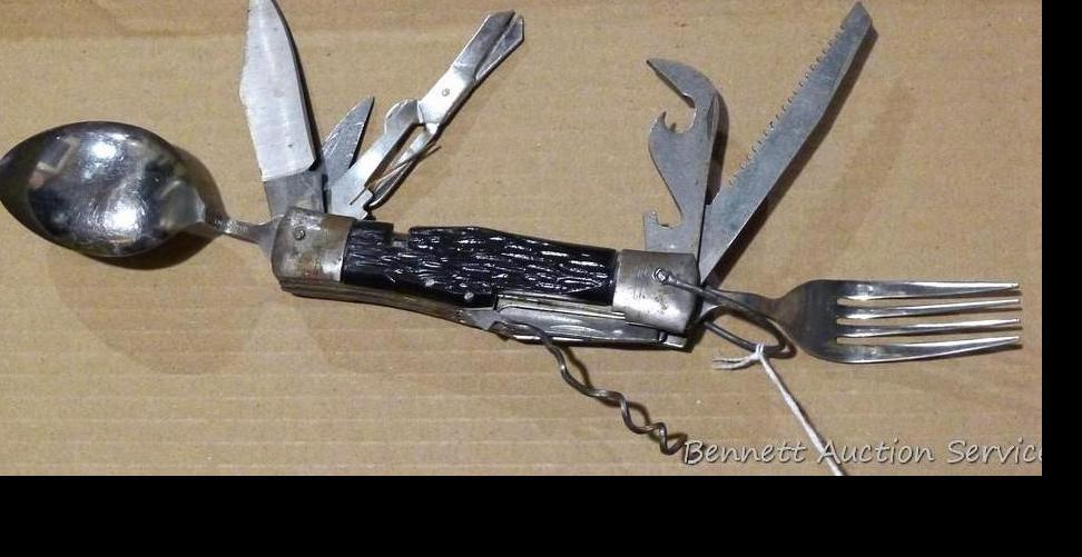 Really cool camp knife includes fork, spoon, corkscrew, knife, scissors, more. Roughly 4-3/4" x 2" x
