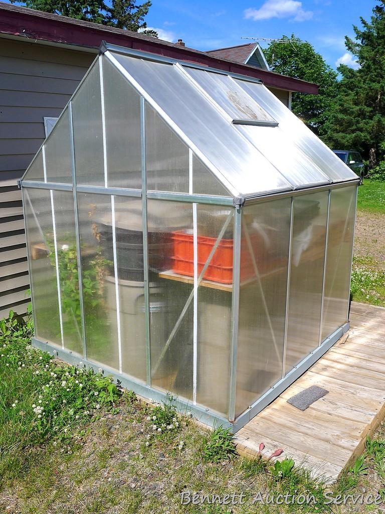 6' x 6' panelized polycarbonate greenhouse on an 8'x8' treated deck and all of the goods inside.