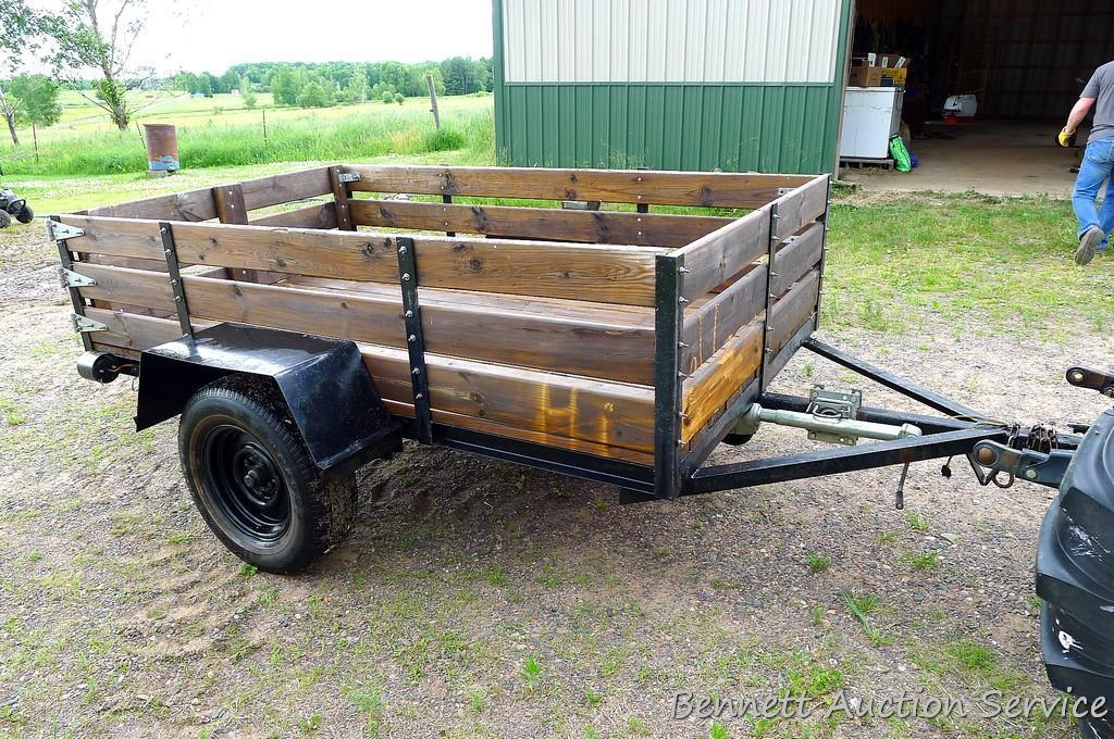 Nice utility trailer is wired for the road. Rear gate swings to the side. Bed is approx. 8' x 5'.