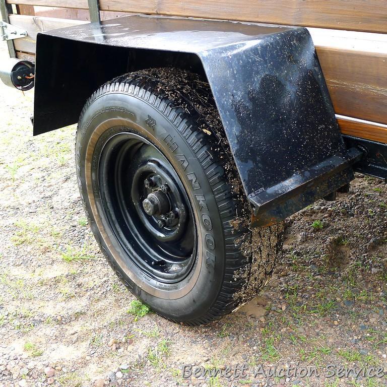 Nice utility trailer is wired for the road. Rear gate swings to the side. Bed is approx. 8' x 5'.