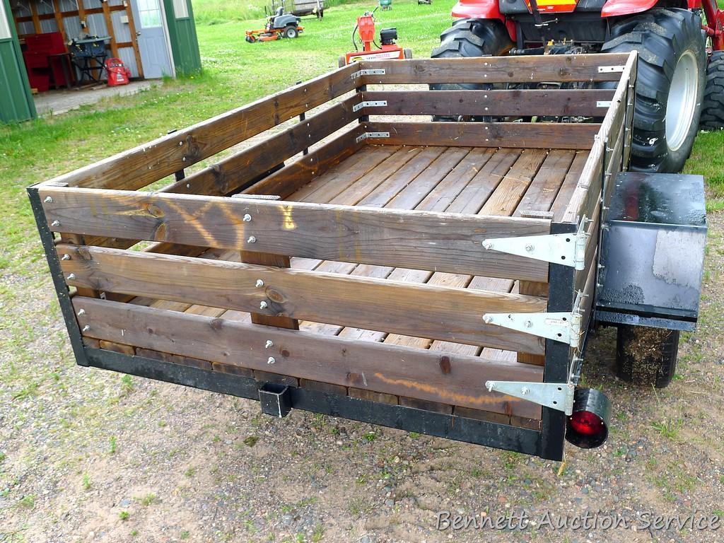Nice utility trailer is wired for the road. Rear gate swings to the side. Bed is approx. 8' x 5'.