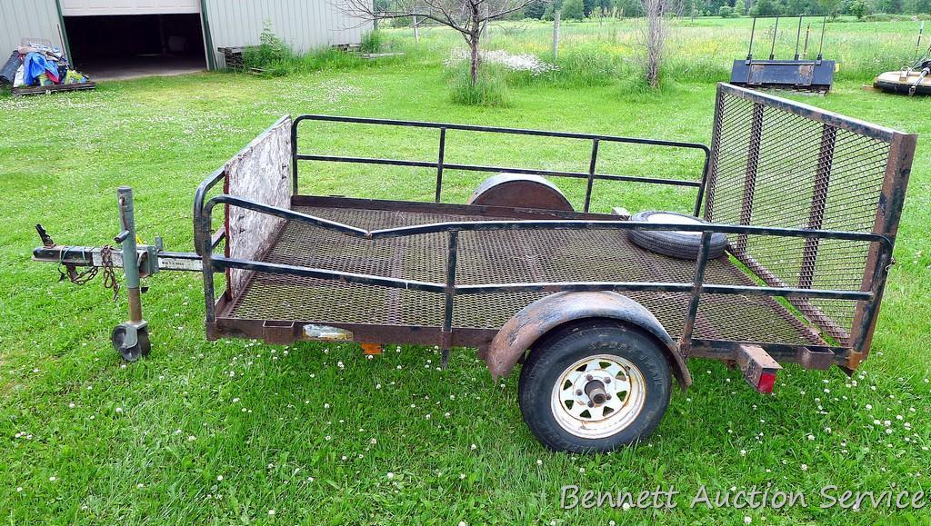 Big Max expanded metal utility ATV trailer with drop ramp and removeable sides. Bed is approx. 8' x