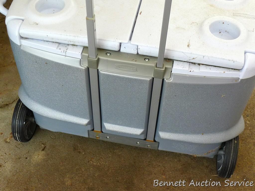 Rubbermaid rolling chest cooler with extendable handle is 28' wide.