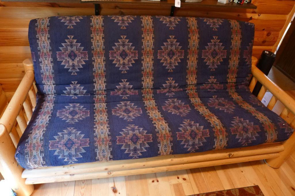 Fantastic log framed futon with 5" thick mattress is in good condition.