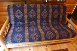 Fantastic log framed futon with 5" thick mattress is in good condition.