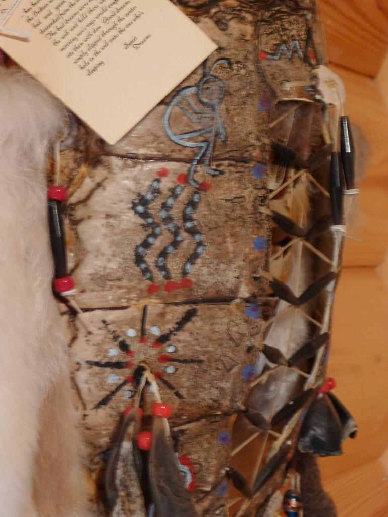 Unique wall hanging with 2 wooden arrows, rabbit fur, turtle shell, antler slices and more. Measures