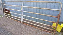 Metal swing gate is 139" long x 51" tall.