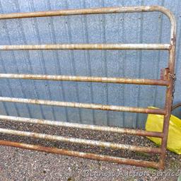 Metal swing gate is 139" long x 51" tall.