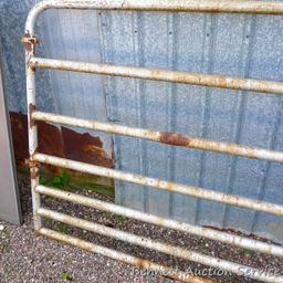 Metal swing gate is 139" long x 51" tall.