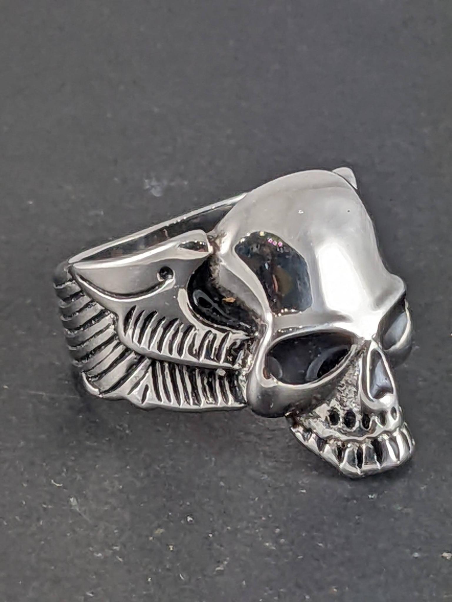 Size 13-1/2 men's skull ring is about 1" tall in front.