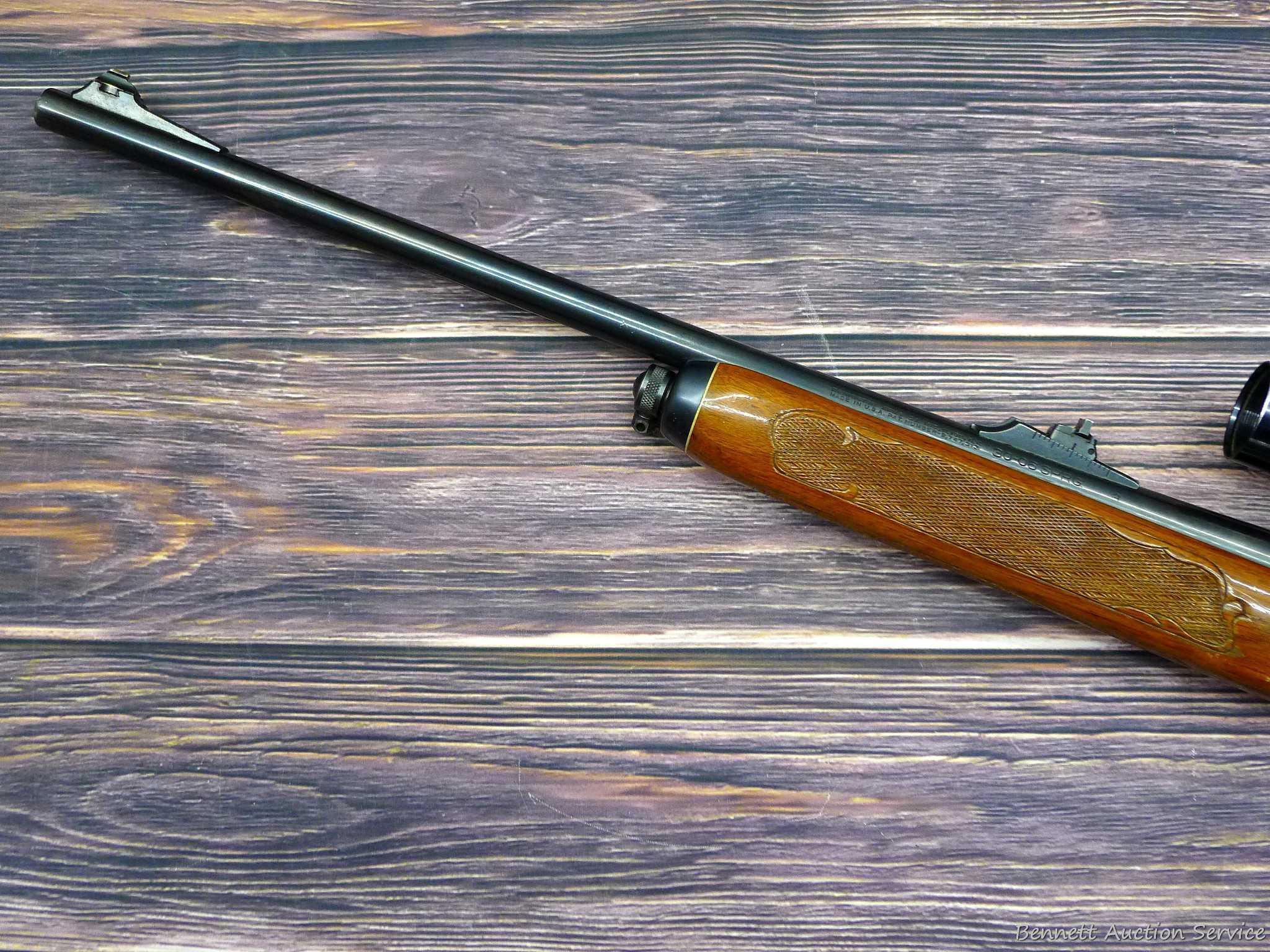 Remington Model 742 Woodsmaster semi-automatic rifle in .30-06 is topped with a 3-9 scope. Barrel is