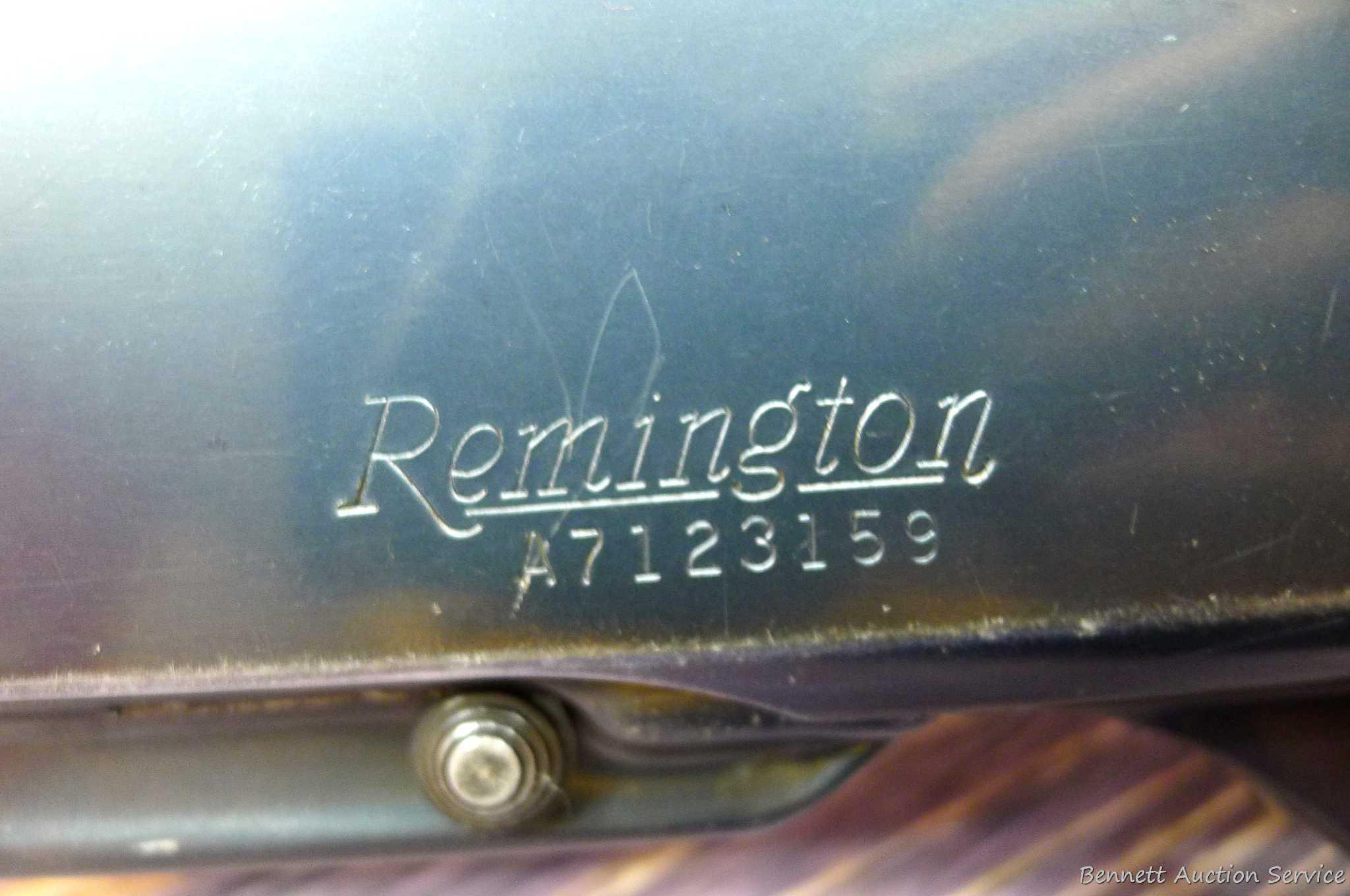 Remington Model 742 Woodsmaster semi-automatic rifle in .30-06 is topped with a 3-9 scope. Barrel is