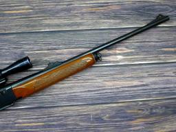 Remington Model 742 Woodsmaster semi-automatic rifle in .30-06 is topped with a 3-9 scope. Barrel is