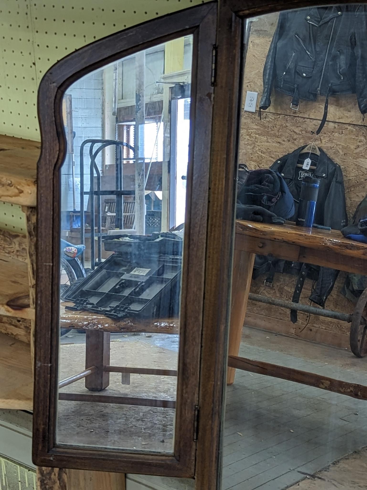 Triple folding mirror is about 44" x 52" and in good condition.