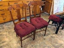 Pair of wooden kitchen chairs are in good condition.