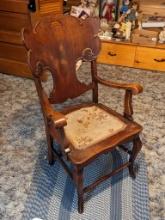 Solid wood curved back side chair is sturdy and in overall good condition.