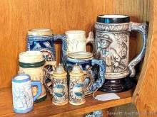Variety of beer mugs in varying sizes; Superior, Wisconsin salt and pepper shakers. Tallest mug