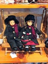 Wooden bench measures 14" over arms and is set up with two porcelain dolls.