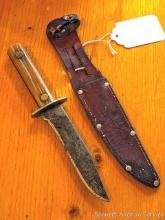 Vintage fixed blade knife with leather sheath. Knife is nearly 9" long. Guard has a slight wiggle,