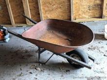 Sturdy wheel barrow has a 26" x 36" tub, tire might just need to be aired.