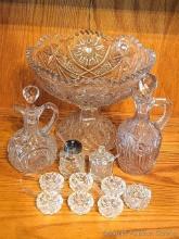 Pedestal glass dish, pair of salad dressing decanters, very tiny serving bowls (maybe for