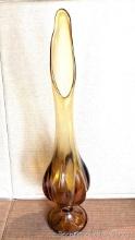 Amber art glass footed vase is about 20" tall and in good condition.