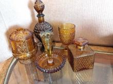 Several amber glass pieces incl 6" hobnail goblet, 11" decanter or similar, candle holder, more.