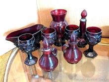 Ruby red glass pieces incl 6-1/2" vase, four 4-1/2" goblets, 8" long gravy boat, more. Pieces seem