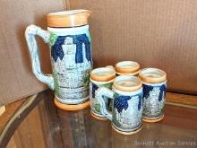 Set of 4 miniature beer mugs or steins about 4-1//2" tall, and a 9-1/2" beer pitcher. All look to be