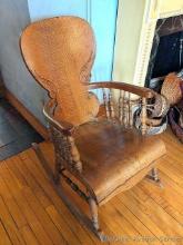 Gorgeous antique rocking chair has beautiful carving. Chair is a little wiggly but should be easy to
