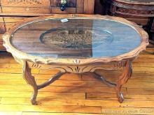 Patriotic eagle coffee table is about 35" x 20" over lift-off glass top, and about 18" tall. Looks