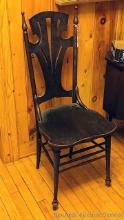Unique wooden kitchen chair; measures 16" x 17" x 40". Finish is in really nice condition, the