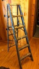 Aluminum ladder; measures 6' tall.