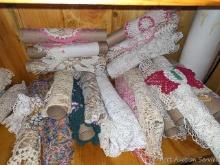 Crocheted doilies stored on paper towel rolls; some doilies measure 24" wide with the doily folded