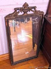 Antique wall mirror with ornate frame and etching on glass; measures 18-1/2" x 36" tall. Has a
