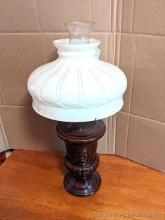 Kerosene lamp with glass chimney and glass shade; measures 10" x 21" tall.