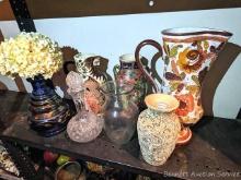 Variety of large pitchers, vases and a decanter style bottle. Very interesting designs perfect for