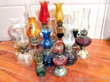 Located upstairs, bring help to remove. Collection of miniature oil lamps up to approx 11". Incl