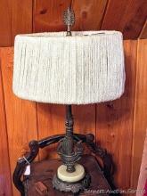 Located upstairs, bring help to remove. Charming antique lamp with marble or glass base is about 25"