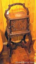 Located upstairs, bring help to remove. Antique smoking stand with carved accents. Measures about