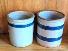 Pair of charming stoneware crocks. Both measure approx 5" tall and have no chips or cracks noted.