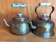 Pair of copper colored tea kettles measure approx 9" over handle. One is O.D.I. and made in