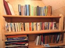 Located upstairs, bring help to remove. Three shelves of books incl coffee table books, novels and