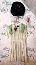 Located upstairs, bring help to remove. Antique dress, gloves, hat. Dress is approx. 33" from
