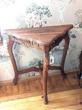 Located upstairs, bring help to remove. Antique carved wall table stands 2' x 2' wide x 1' deep.