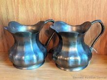 Matching set of heavy brass or similar pitcher decorations stands 5-1/2" tall. Made in Italy.